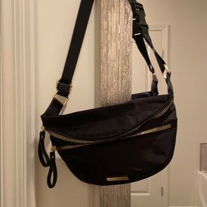 Adrienne Vittadini fanny pack in black.